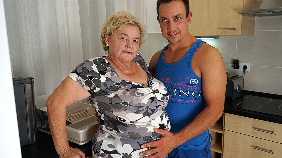 Curvy granny sucking and fucking a way younger dude in her kitchen