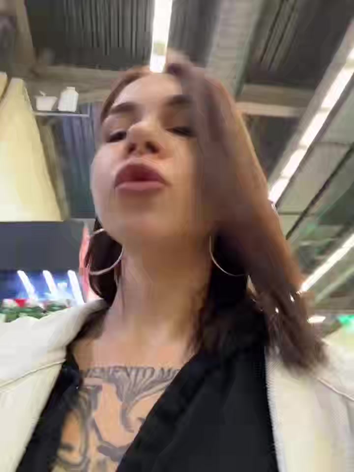 Stunning Tattooed Woman Flirts and Poses in Store and Restroom